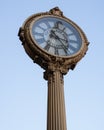 Flatiron building reflected in street clock