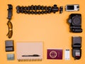 Flatlay accesories of a travel blogger on pastel orange background Royalty Free Stock Photo