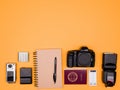 Flatlay accesories of a travel blogger on pastel orange background Royalty Free Stock Photo