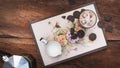 Flatlay of cofee, milk and chocolate on a hipster tray