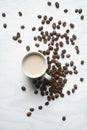 Flatlay coffee cup and coffee beans on a white background