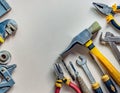 Flatlay of DIY tools, hammer, pliers, screwdriver for handymen. Manual work