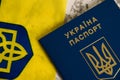 Ukraine, Chernihiv, July 5, 2023: Flatlay, flag of Ukraine with coat of arms and passport of citizen of Ukraine on light