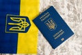 Ukraine, Chernihiv, July 5, 2023: Flatlay, flag of Ukraine with coat of arms and passport of citizen of Ukraine on light