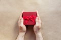 Flatlay holidays giftbox present in man hands on the craft paper Royalty Free Stock Photo