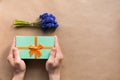 Flatlay holidays mint giftbox present in man hands Royalty Free Stock Photo