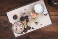 Flatlay of cofee, milk and chocolate on a hipster tray