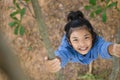 Flatlay Little girl have fun playing climb tree