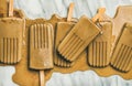 Flatlay of melting coffee latte popsicles on grey background