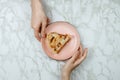 Flatlay of men passing the piece of apple pie to woman`s hand Royalty Free Stock Photo