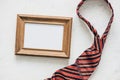 Flatlay, necktie and blank frame. Father`s day concept