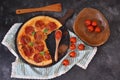 Flatlay pan of pizza and tomatoes