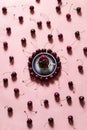 Flatlay on pink background with cherries and blue porcelain plate in centre with cup of berries