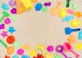 Flatlay playground, sandbox and multi-colored plastic toys. Royalty Free Stock Photo