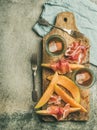 Flatlay of rose wine, prosciutto ham, melon, copy space Royalty Free Stock Photo