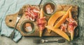 Flatlay of rose wine, prosciutto ham, melon, top view Royalty Free Stock Photo