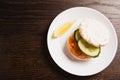 Flatlay, sandwich with salmon and cucumber and lemon on white plate