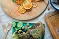Flatlay of snack plate and boards with linen breads, fresh vegetables, dried fruits, fruit candies, nuts, olives, himalaya salt Royalty Free Stock Photo