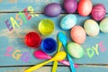Flatlay, text easter egg dye on blue table with selfmade materials Royalty Free Stock Photo