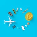 Flatlay with toy plane with sun glasses, slippers, hat, suntan cream, phone and camera on blue minimal style background. Travel