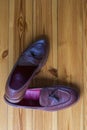 Flatlay Upper View of Two Pair of Traditional Formal Stylish Brown Pebble Grain Tassel Loafer Shoes On One Another