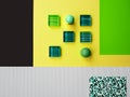 Flat lay various geometric paper shape,glass mosaic,2 ball turquoise green stone,rectangle plant ornament,copy space