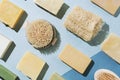 Flatlay of various natural handmade soap, body brushes and loofah sponge Royalty Free Stock Photo