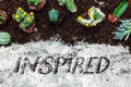 Flatlay, various sorts of cacti and succulents on potting compost, english word inspired