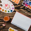 Flatlay of various stationery supplies knolled together on wooden table Royalty Free Stock Photo