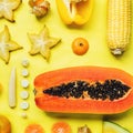 Flatlay of various yellow and orange fruits and vegetables