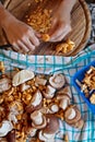 Flatlay, woman is cleaning Porcini and chanterelles