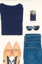 Flatlay of women`s stylish neutral outfit on white background. Trendy clothes collage. Minimal and beauty blog concept.