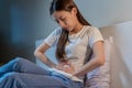Flatulence ulcer, asian young woman in belly, stomach ache from food poisoning, abdominal pain and digestive problem, gastritis or Royalty Free Stock Photo