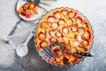 Flaugnarde or Clafoutis - French dessert with plums, large pancake baked in oven Royalty Free Stock Photo