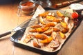 Flavored Fried Potatoes on Black Tray with Paper