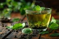 flavored green tea on wooden table with leaves over side, translucent water. Generative AI Royalty Free Stock Photo