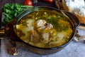 Flavored soup of dried porcini mushrooms in a glass tureen. Royalty Free Stock Photo