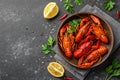 Flavorful boiled crawfish. On a stone background Royalty Free Stock Photo