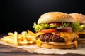 Flavorful combo Tasty beef burger, cheese, and crispy French fries satisfy cravings Royalty Free Stock Photo