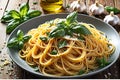 A Flavorful Presentation: Cooked Spaghetti Aglio e Olio with Garlic and Olive Oil, Glistening with Chili Flakes Sprinkled