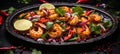 Flavorful spicy thai seafood salad with fresh vegetables on sleek black plate, top view Royalty Free Stock Photo