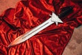 Antique roman short sword its on red cape on floor