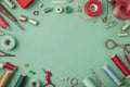 Flawless Visual of a Flat Lay of Various Sewing Supplies on a Green Background Royalty Free Stock Photo