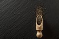 Flax chia seeds in wooden spoon on black food background. Pile superfood. Vitamin antioxidant breakfast or morning snack Royalty Free Stock Photo