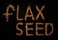 Flax sedds text on black background Royalty Free Stock Photo