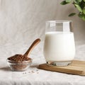 flax seed milk in glass on textile background with plant. copy space. Royalty Free Stock Photo