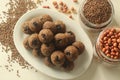 Flax seed peanut laddu. Indian sweet made with coarsely ground flax seeds and groundnuts with freshly grated coconut and jaggery,