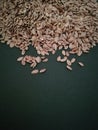 Flax seeds on black background, vintage color