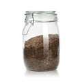 Flax seeds in clear jar isolated on white background. Natural grain for healthy eating. Clipping path