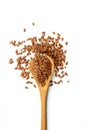 Flax seeds. Flaxseed powder in a wooden spoon. Standing on a white background Royalty Free Stock Photo